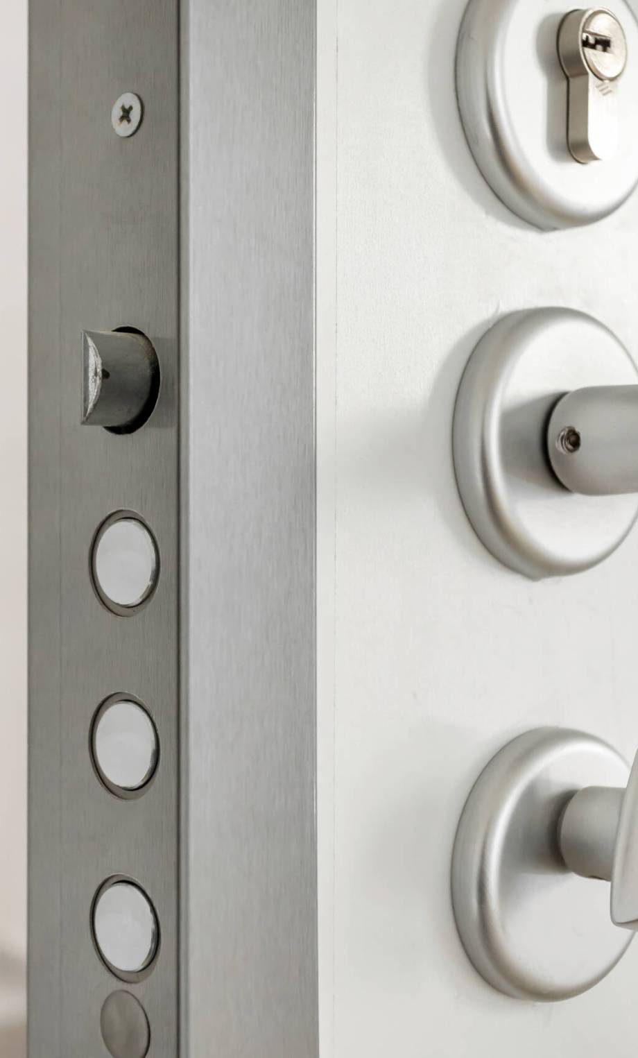 Close-up look at high security lock of an white armored home door